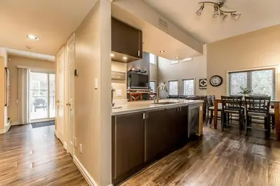 a kitchen and living room with a dining room at Mountain Walk Retreat - Walk to Blue Patio area in Blue Mountains