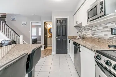 a kitchen with a sink and a counter top at Mountain View Ski-In-Out Pool Shuttle to Blue in Blue Mountains