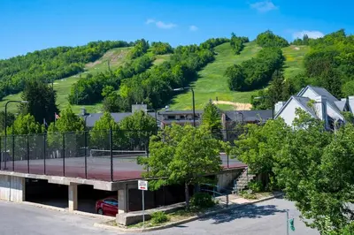 an overhead view of a parking lot with a tennis court at Whispering Pines - Ski-In-Ou Pool Shuttle in Blue Mountains