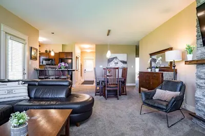 a living room with a couch and a table at Hickory Ridge Across Blue Mtn Hot Tub Shuttle in Blue Mountains