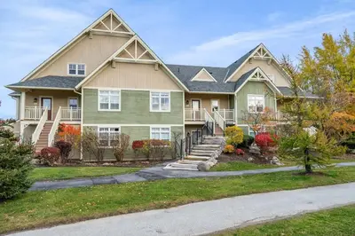 a large house with a staircase in front of it at The Blue - Walk to the Village Shuttle & Hot Tub in Blue Mountains