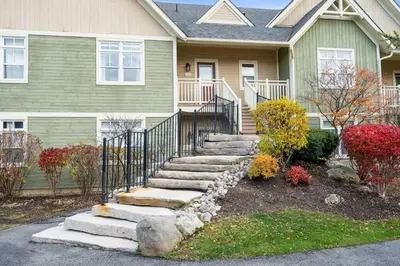 a house with stairs in front of it at The Blue - Walk to the Village Shuttle & Hot Tub in Blue Mountains