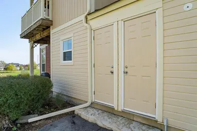 a pair of garage doors on the side of a house at Sunny Days - Steps to Blue Mtn - Hot Tub & Shuttle in Blue Mountains