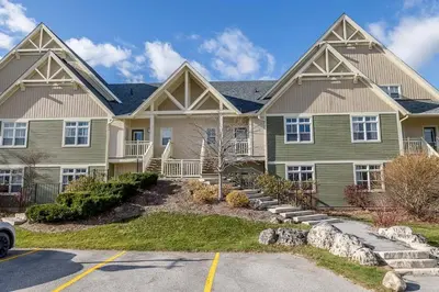 a large house with at Raccoon Ridge - Village Walk - Hot Tub - Shuttle in Blue Mountains