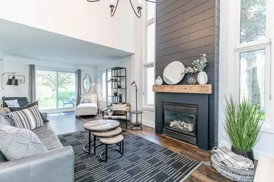 a living room with a couch and a fireplace at Hip Hideaway - Family Fun Walk to the Village in Blue Mountains