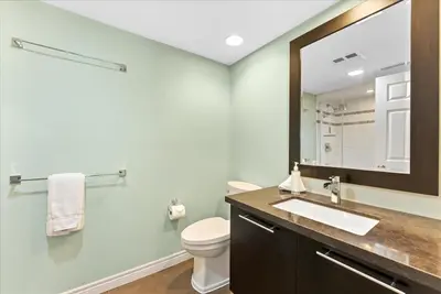 a bathroom with a toilet and a sink and a mirror at Sierra Peaks - Village and Golf retreat in Blue Mountains