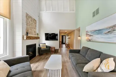 a living room with a couch and a fireplace at Sierra Peaks - Village and Golf retreat in Blue Mountains