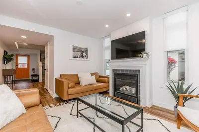 a living room with a couch and a fireplace at Sierra Summit - Walk to the Village family fun in Blue Mountains