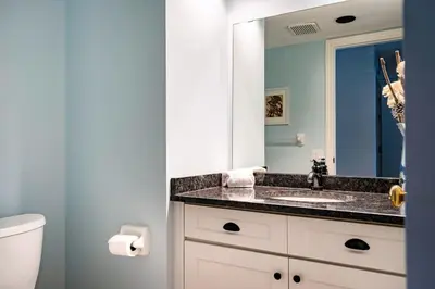 a bathroom with a sink and a mirror at Sierra Views - Steps to Blue Mountain Village in Blue Mountains