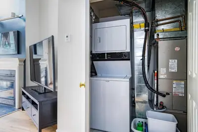 a kitchen with a washer and dryer in an rv at Sierra Views - Steps to Blue Mountain Village in Blue Mountains