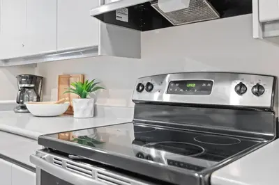 a kitchen with a stove top oven in a kitchen at Sierra Heights - Steps to Blue Mountain Village in Blue Mountains