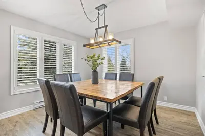 a dining room with a wooden table and chairs at Sierra Heights - Steps to Blue Mountain Village in Blue Mountains