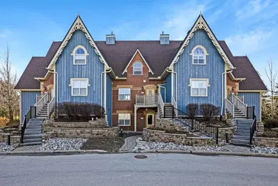 a large blue house with two turrets at Out of the Blue - Shuttle to Blue Walk & Trails in Blue Mountains