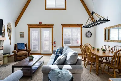 a living room with a couch and a table at Out of the Blue - Shuttle to Blue Walk & Trails in Blue Mountains