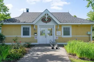 a yellow house with a bench in front of it at Out of the Blue - Shuttle to Blue Walk & Trails in Blue Mountains