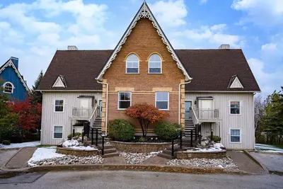 a brick house with a gambrel roof at Snowy Mountain Summit & Sol - Shuttle - Patio in Blue Mountains