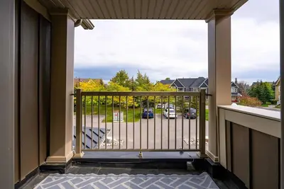 a balcony with a view of a parking lot at Blue Mountain Townhome - Patio Shuttle Trails in Blue Mountains