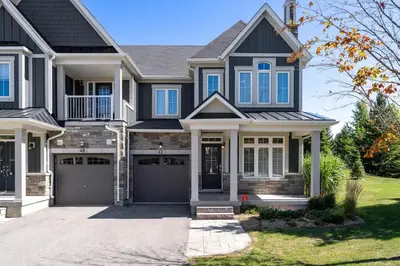 a black house with a garage at Luxury Mountain Townhome - Shuttle Patio & Trails in Blue Mountains