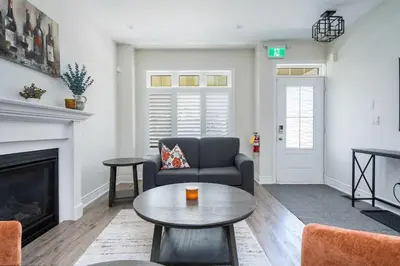 a living room with a couch and a table at Luxury Mountain Townhome - Shuttle Patio & Trails in Blue Mountains
