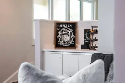a room with a shelf with a picture of a spacemen sidx sidx at Memory Lane - Walk to the Village - Sleeps 10 in Blue Mountains