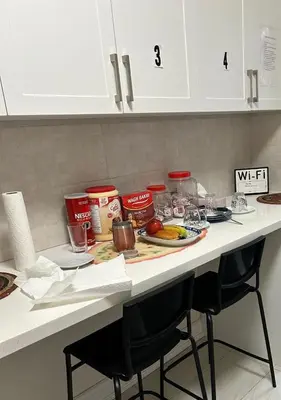 a kitchen counter with a table with food on it at V-Swim Suite-2 in Toronto