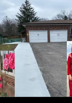 a house with a driveway with a garage at V-Swim Suite-2 in Toronto