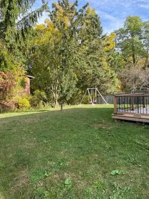 a park with a bench and a playground at V-Swim Suite-2 in Toronto