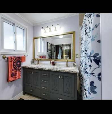 a bathroom with a sink and a mirror at Grimsby Lakeside Vacation Home in Grimsby