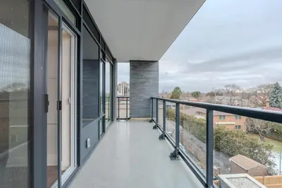 a balcony with a view of the city at RivetStays - The Westmounts in Toronto