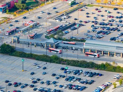 an aerial view of a parking lot with cars at The Grand Aurelia Suites - Mississauga City Center in Mississauga