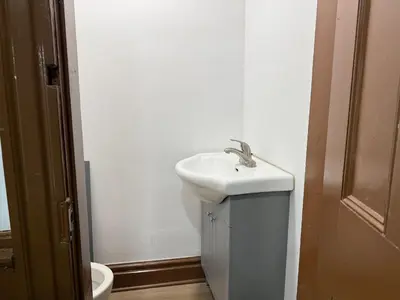 a bathroom with a sink and a toilet at Downtown Residence Room 3 in Guelph