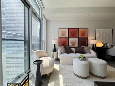a living room with a couch and a table at Deluxe Suites & Towers Downtown Toronto in Toronto