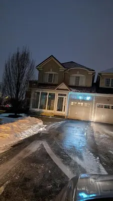 a house with a car parked in a driveway at Bright Bedroom with Shared bathroom and WiFi Parking available in Markham