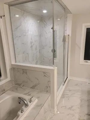 a bathroom with a shower and a tub and a sink at AyrHaus- Modern Comfort Meets Small-Town Charm