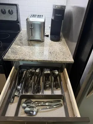 a drawer in a kitchen with forks and spoons at The greatest views in the heart of Mississauga in Mississauga