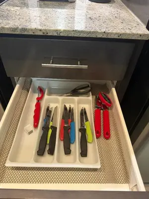 a drawer with four pairs of scissors on a tray at The greatest views in the heart of Mississauga in Mississauga
