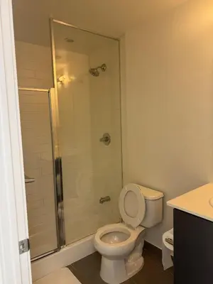 a bathroom with a toilet and a shower at The greatest views in the heart of Mississauga in Mississauga