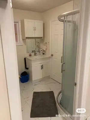 a small bathroom with a shower and a sink at M2 Private cozy bedroom in Mississauga