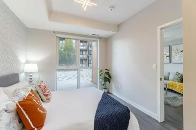 a bedroom with a bed and a window at 1 BR Boutique Charm, Urban Calm! in Oakville