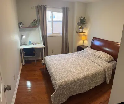 a bedroom with a bed and a sink and a window at 203 Comfortable private bedroom on second floor in Mississauga