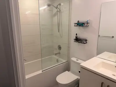 a bathroom with a shower and a toilet and a sink at Uniqueplace in Vaughan