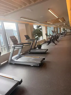 a gym with bikes and exercise equipment in a building at Uniqueplace in Vaughan