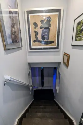 a stairway with a painting on the wall at Room Ideal for Knowledge Workers in Toronto