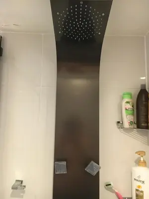 a bathroom with a black and white wall at Hamilton condo, close to Toronto and Niagara Falls in Hamilton