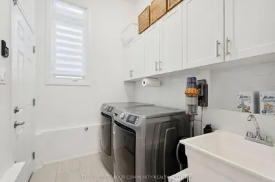 a kitchen with a dishwasher in a white kitchen at North City Haven - Cozy 2 Bedroom Retreat in Barrie