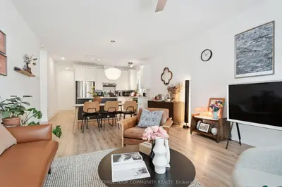 a living room with a couch and a table at North City Haven - Cozy 2 Bedroom Retreat in Barrie
