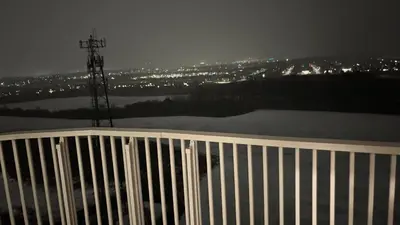 a view of a city from a balcony at night at Trafalgar in Oakville