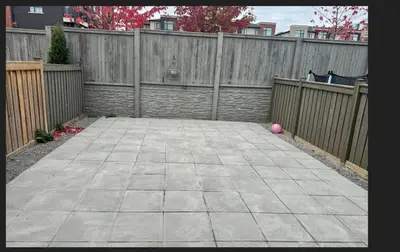 a patio with a fence and a pink ball at Cozy 3 Bed Whole Rental Home for your stay! in Brampton