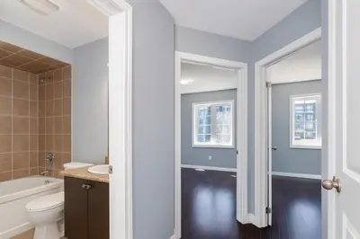 a bathroom with a toilet and a tub and a sink at Cozy 3 Bed Whole Rental Home for your stay! in Brampton
