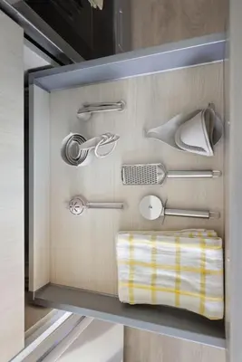 a drawer with various kitchen utensils in it at Cozy 1BR Suite Steps to Subway City Views in Toronto